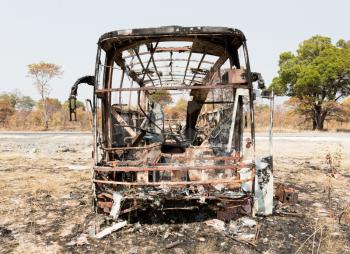 Burned bus at the side of the road, Botswana