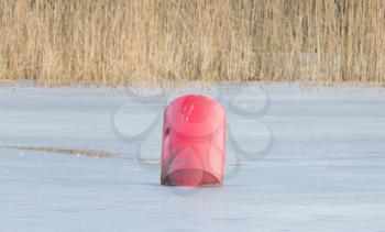 Red buoy in a large pond - Selective focus