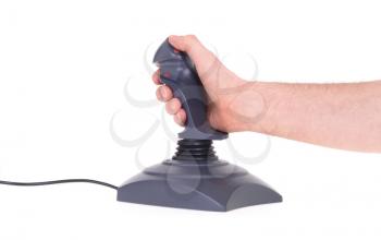 Hand holding gaming joystick, isolated on a white background