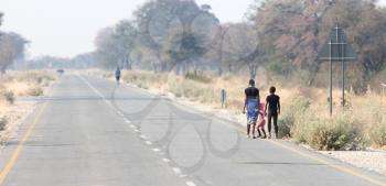 People walking at the side of the road, Namibia