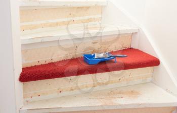 Removing carpet, glue and paint from an vintage stairs - Selective focus