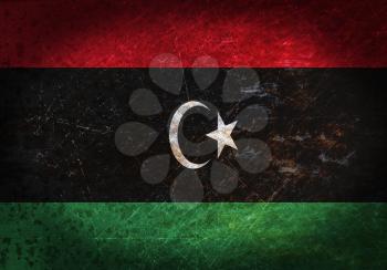 Old rusty metal sign with a flag - Libya