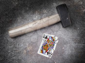 Hammer with a broken card, vintage look, queen of clubs