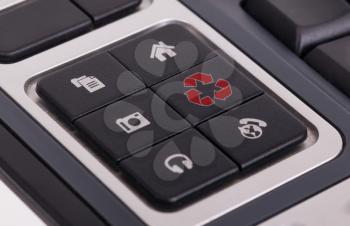 Buttons on a keyboard, selective focus on the middle right button - Recycle