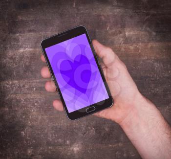 Heart shape backgound on a tablet - Concept of love - purple