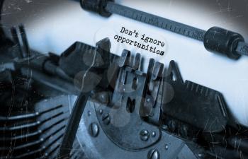 Close-up of an old typewriter with paper, perspective, selective focus, don't ignore opportunities