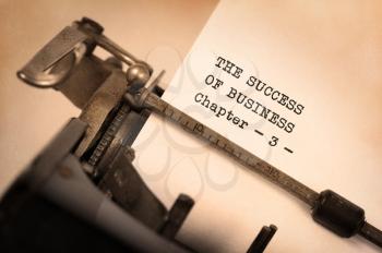Vintage typewriter, old rusty, warm yellow filter - The succes of business, chapter 3