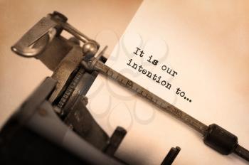 Close-up of an old typewriter with paper, selective focus, It is our intention to