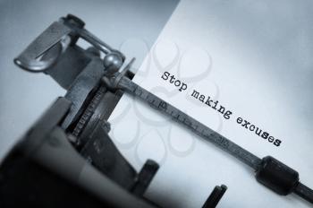 Vintage inscription made by old typewriter, Stop making excuses