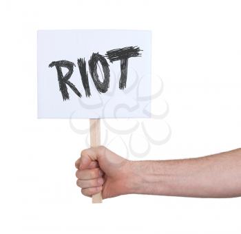 Hand holding sign, isolated on white - Riot
