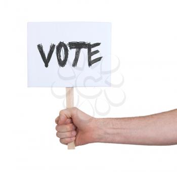 Hand holding sign, isolated on white - Vote