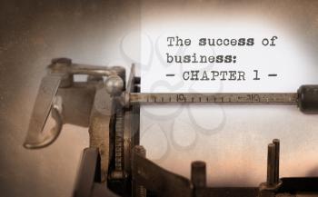 Vintage typewriter, old rusty, warm yellow filter - The succes of business, chapter 1