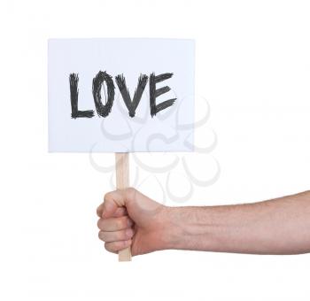 Hand holding sign, isolated on white - Love