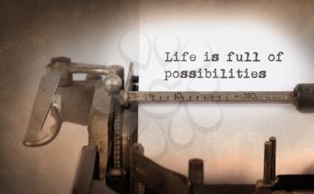 Vintage inscription made by old typewriter, life is full of possibilities