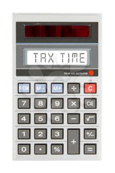 Old calculator showing a text on display - tax time