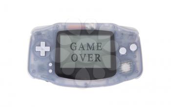 Old dirty portable game console with a small screen - game over