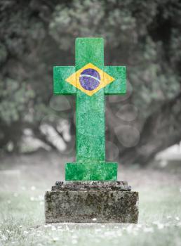 Old weathered gravestone in the cemetery - Brazil