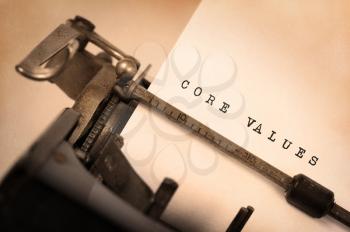 Close-up of a vintage typewriter, old and rusty, core values