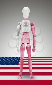 Old wood figure mannequin with US state flag bodypaint - California