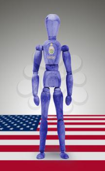 Old wood figure mannequin with US state flag bodypaint - Kansas
