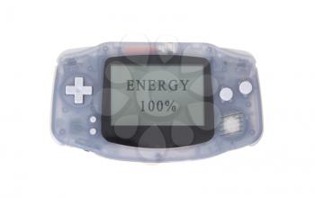 Old dirty portable game console with a small screen - energy at 100 percent