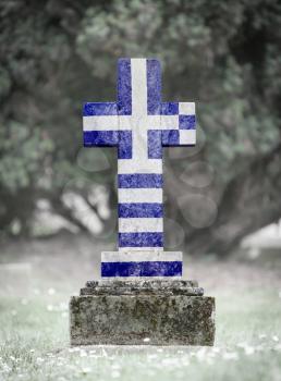 Old weathered gravestone in the cemetery - Greece