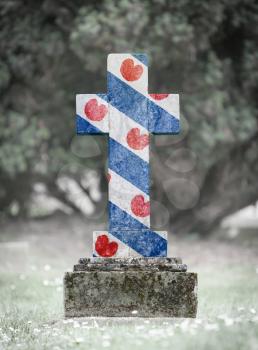 Old weathered gravestone in the cemetery - Friesland