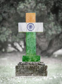 Old weathered gravestone in the cemetery - India