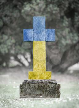 Old weathered gravestone in the cemetery - Ukraine