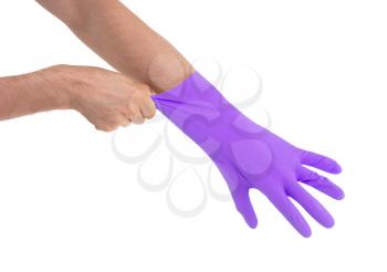 Hand in purple glove - isolated on white background
