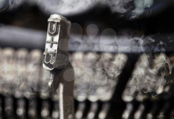U hammer for writing with an old manual typewriter - mystery smoke
