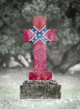 Old weathered gravestone in the cemetery - Confederation flag