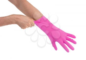 Hand in pink glove - isolated on white background