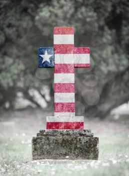 Old weathered gravestone in the cemetery - Liberia