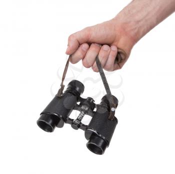 Vintage binocular in mans hand, isolated on white