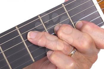 Old hand and guitar isolated on white background