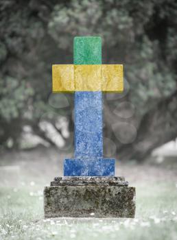 Old weathered gravestone in the cemetery - Gabon