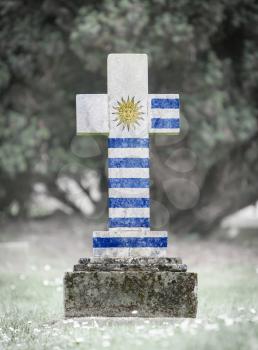 Old weathered gravestone in the cemetery - Uruguay