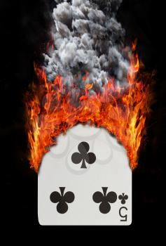 Playing card with fire and smoke, isolated on white - Five of clubs