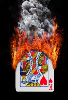 Playing card with fire and smoke, isolated on white - King of hearts