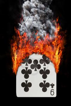 Playing card with fire and smoke, isolated on white - Nine of clubs