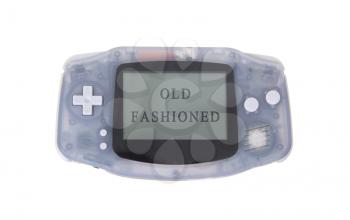 Old dirty portable game console with a small screen - old fashined
