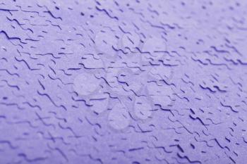 Old puzzle - Pieces connected - Selective focus on the middle - Purple