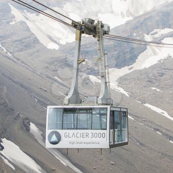 LES DIABLERETS, SWIZTERLAND - JULY 22: Ski lift to area Glacier 3000 on July 22, 2015. The area houses the world only suspension bridge between 2 mountain peaks.