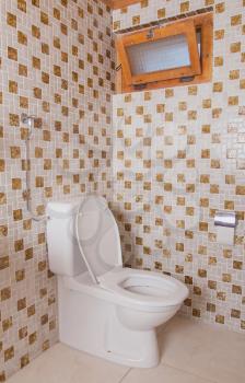 Old clean toilet with old tiles (80s)