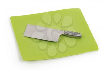 Large modern chef's knife on plastic chopping block