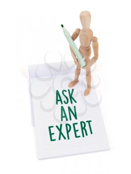 Wooden mannequin writing in a scrapbook - Ask an expert
