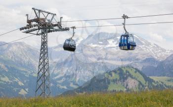 Lenk im Simmental, Switzerland - July 12, 2015: Ski lift in mountain during the summer. The village is located in the canton Bern, Lenk, August 12, 2015