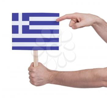Hand holding small card, isolated on white - Flag of Greece