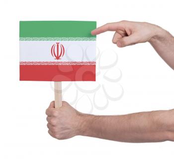 Hand holding small card, isolated on white - Flag of Iran